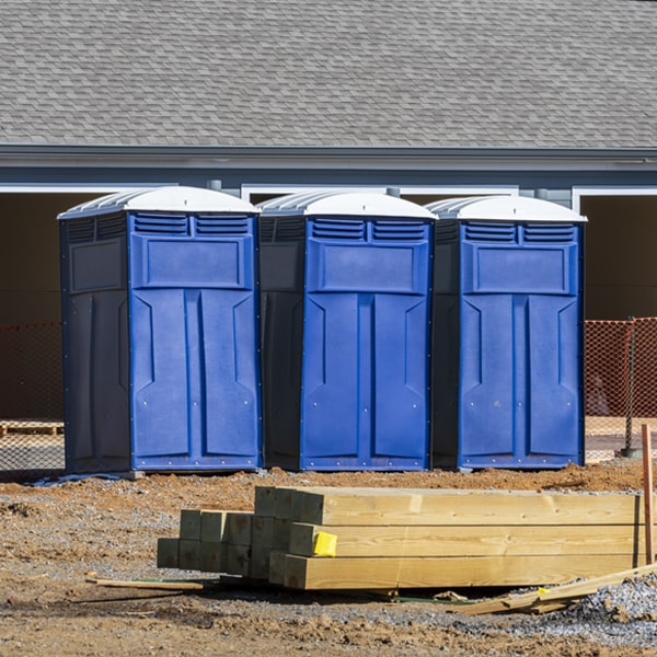 what is the cost difference between standard and deluxe portable toilet rentals in Heritage Village